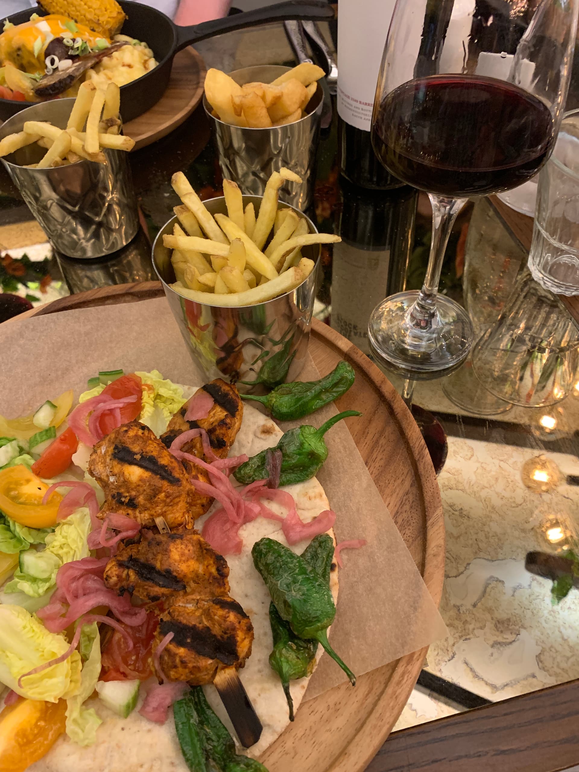 Chicken and fries, along with charred jalapenos in Birmingham, UK